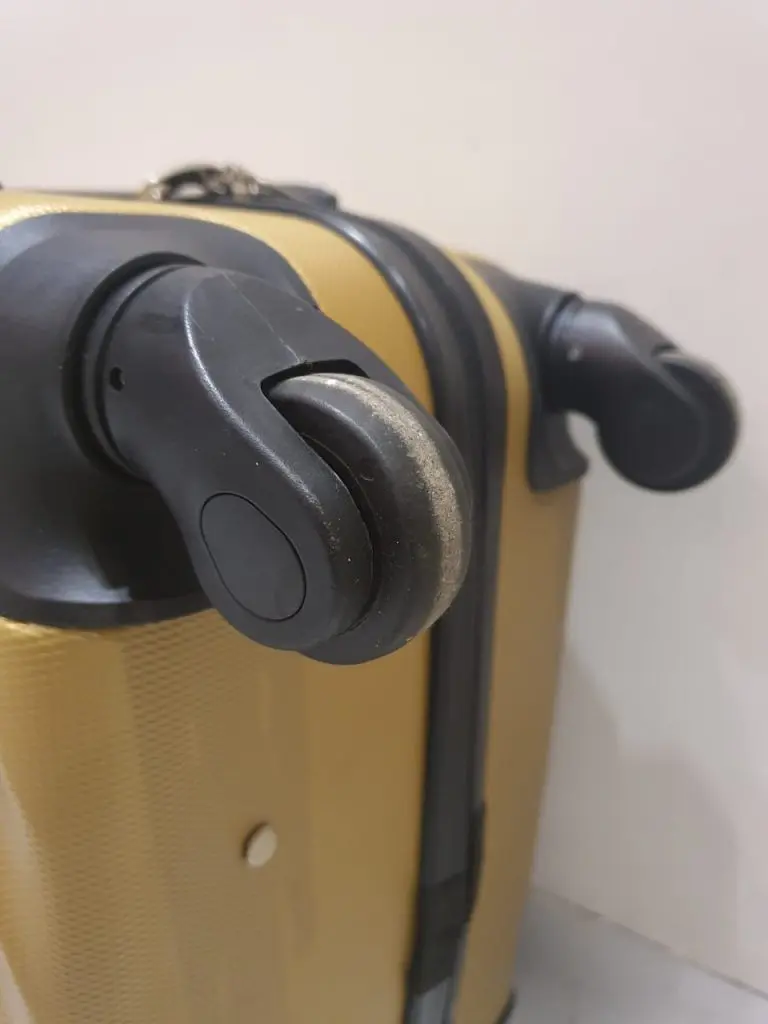 how to make luggage wheels smoother